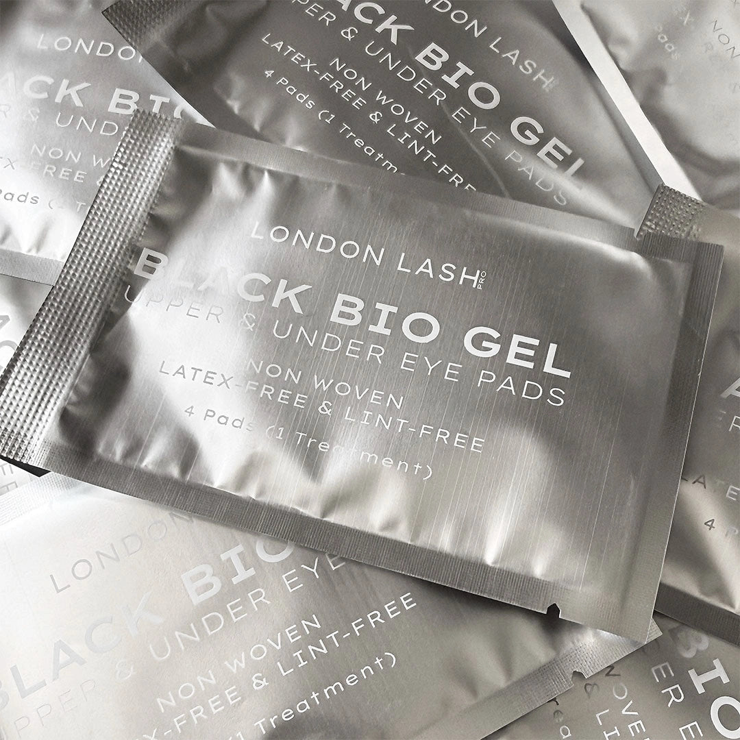 A cluster of individual metallic silver foil sachets for London Lash Black Bio Gel Upper & Under Eye Pads.
