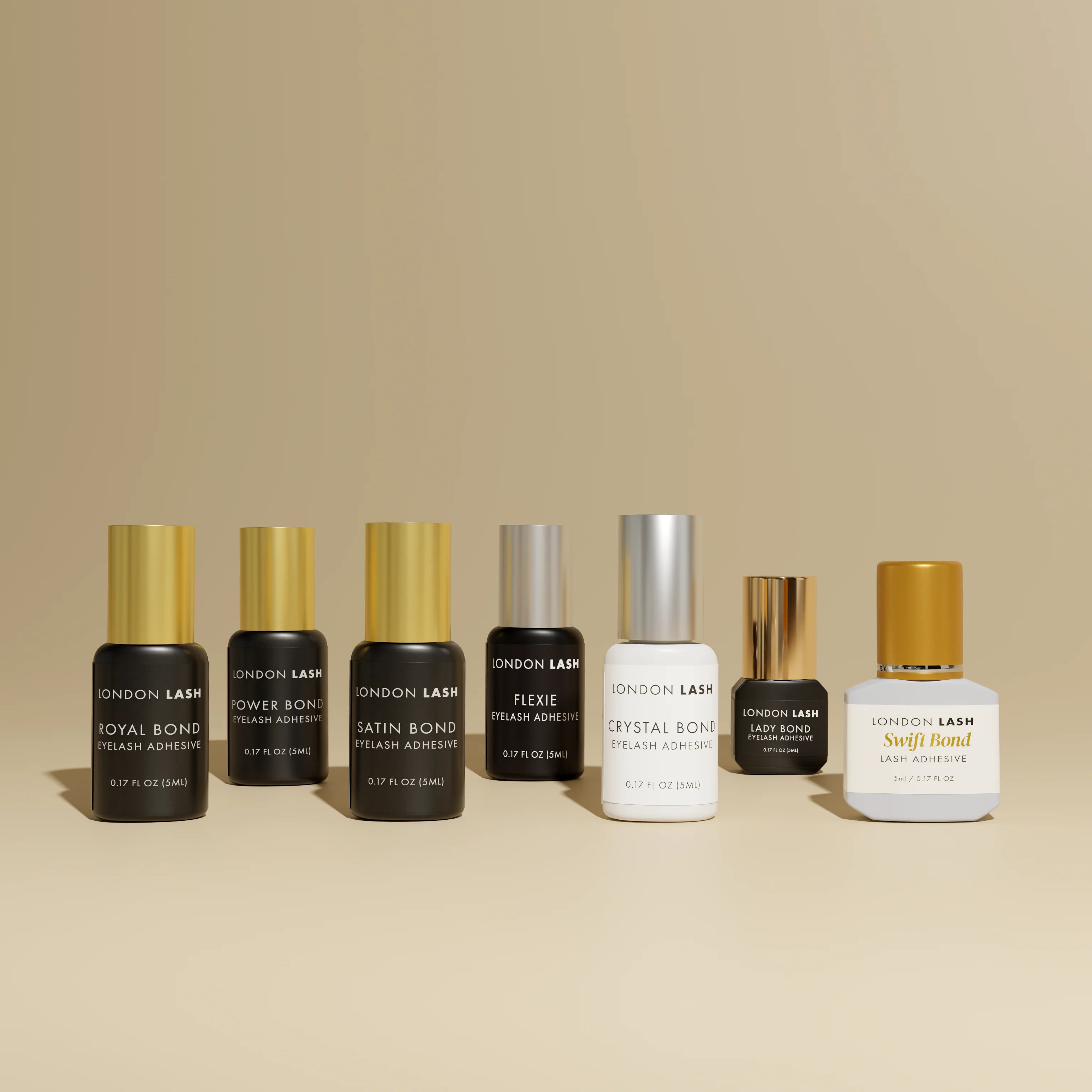 Collection of London Lash Glue bottles for the London Lash Glue Subscription plan, showing different adhesive options available in the UK.