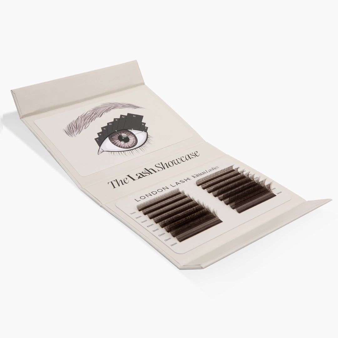 Open lash palette displaying an eye mapping guide inside the lid and two trays of brown Kitten Lash extensions below.